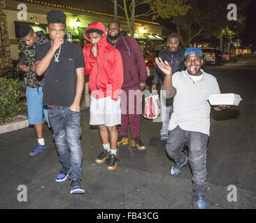 Tyrin Turner and rapper Lil Caine The Artist leaving BJ’s with friends in Thousand Oaks  Featuring: Tyrin Turner, Lil Caine The Artist Where: Thousand Oaks, California, United States When: 08 Dec 2015 Stock Photo