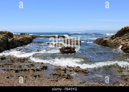 Waves crashing on rocks Stock Photo