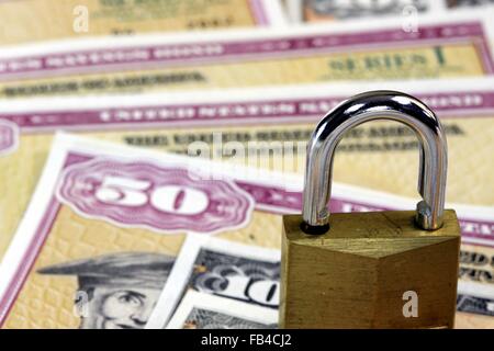 United States Savings Bonds with padlock - Financial security concept Stock Photo