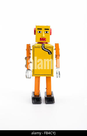 Yellow retro toy robot on white background Stock Photo