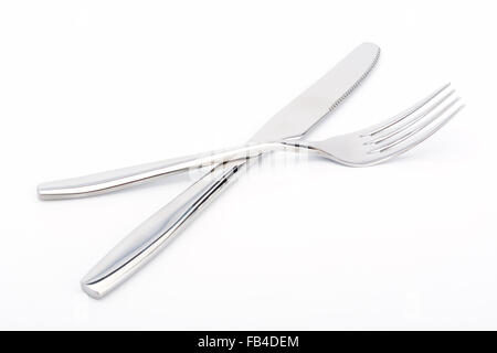 Knife and fork crossed on white background Stock Photo