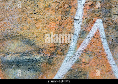 Orange Aged Wall Made of Small Rocks with white lines Stock Photo