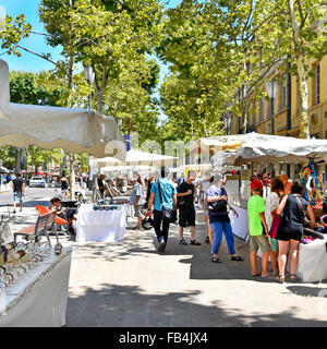 Aix en Provence France Sunday all white French street market stalls & canopies along tree lined Cours Mirabeau on hot summers day in Provence France Stock Photo