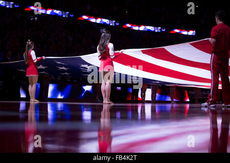 Madison, WI, USA. 9th Jan, 2016. Wisconsin cheerleaders hold the American flag at the start of the NCAA Basketball game between the Maryland Terrapins and the Wisconsin Badgers at the Kohl Center in Madison, WI. Maryland defeated Wisconsin 63-60. John Fisher/CSM/Alamy Live News Stock Photo