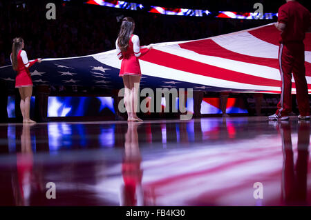 Madison, WI, USA. 9th Jan, 2016. Wisconsin cheerleaders hold the American flag at the start of the NCAA Basketball game between the Maryland Terrapins and the Wisconsin Badgers at the Kohl Center in Madison, WI. Maryland defeated Wisconsin 63-60. John Fisher/CSM/Alamy Live News Stock Photo