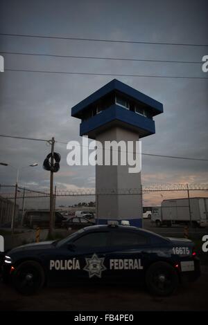 (160109) -- ALMOLOYA DE JUAREZ, Jan 9, 2016 (Xinhua) -- Image taken on July 12, 2015 shows a Federal Police Vehicle guarding the main entrance to the Altiplano prison, in Almoloya de Juarez Township, Mexico state, Mexico. After an early morning raid in northwestern Mexico's Sinaloa State's town of Los Mochis by Mexican police and marines on Friday, Sinaloa Cartel leader Joaquin 'El Chapo' Guzman Loera was recaptured, six months after his second prison break. In 2001, Guzman was wheeled out by a janitor in a laundry cart. In 2015, Guzman escaped from prison after his allies dug a tunnel about a Stock Photo