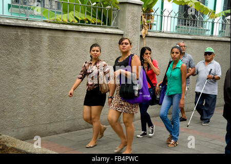 Ecuadoran people walking on the street in Guayaquil Stock Photo