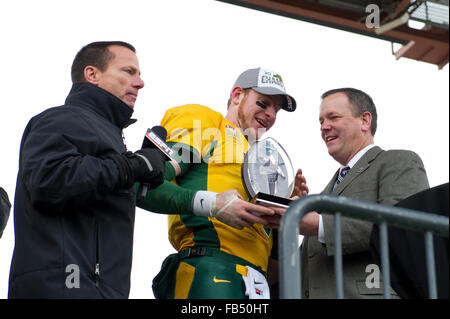 Frisco, Texas, USA. 9th Jan, 2016. North Dakota State Bison quarterback Carson Wentz (11) accepts the MVP trophy after the 2016 NCAA Division 1 Football Championship game between the Jacksonville State Gamecocks and the North Dakota State Bison at Toyota Stadium, in Frisco, Texas. The North Dakota State Bison won their 5th straight Championship defeating the Jacksonville State Gamecocks 37-10. Shane Roper/CSM/Alamy Live News Stock Photo