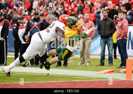 Frisco, Texas, USA. 9th Jan, 2016. North Dakota State Bison quarterback Carson Wentz (11) escapes Jacksonville State Gamecocks defensive lineman Desmond Owino (92) and runs for a touchdown during the first half of the 2016 NCAA Division 1 Football Championship game between the Jacksonville State Gamecocks and the North Dakota State Bison at Toyota Stadium, in Frisco, Texas. Shane Roper/CSM/Alamy Live News Stock Photo