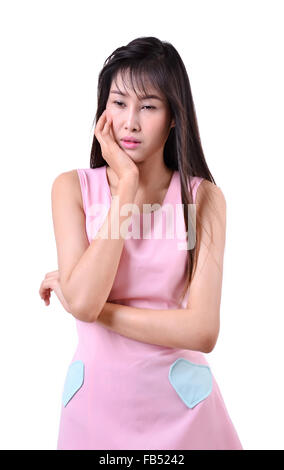 Sad beautiful woman standing against a white background Stock Photo