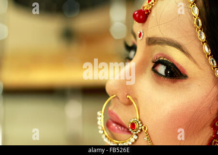 Beautiful indian bride in rich ethnic dress. eye make up Stock Photo