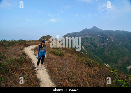 Trekker heading to the summit of Sharp Peak, Sai Kung, Hong Kong Stock Photo