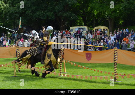 Two Medieval knights on horseback at a jousting tournament at Linlithgow Palace, Scotland Stock Photo