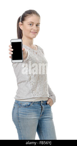 a happy young woman showing blank smartphone screen Stock Photo