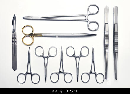 Neatly arranged various surgical instruments on a white background Stock Photo