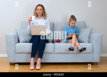 Mother and daughter spending time together. Modern family concept. Stock Photo