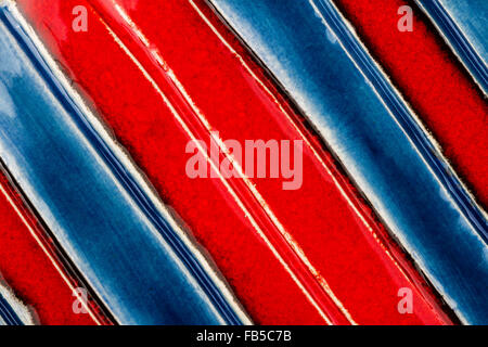 Closeup shot of glazed red and blue ceramics texture Stock Photo