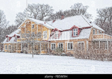 A snow covered house situated at ramlosa brunnspark on the outskirts of Helsingborg in Sweden. Stock Photo