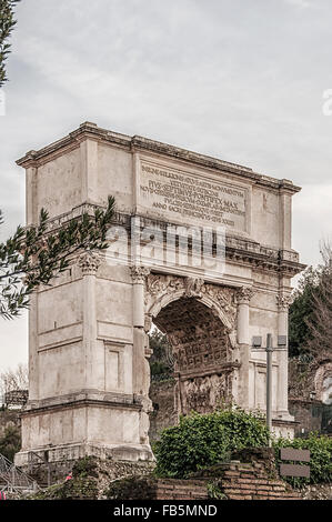 The Arch of Titus is a 1st-century honorific arch located on the Via Sacra, Rome, just to the south-east of the Roman Forum. Stock Photo