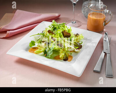Blood orange vinaigrette with salad Stock Photo