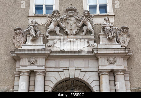 Sculpture composition with ancient Coat of Arms on the wall over gate to DomQuartier in Salzburg, Austria Stock Photo