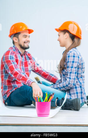 Pleasant couple drawing plan Stock Photo