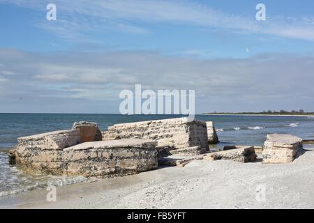 Ruins crumbling into the ocean at Fort Desoto in St. Petersburg, Florida. Stock Photo