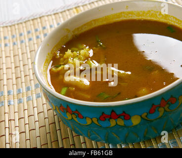 Ash-e Jow - Iranian,Persian Barley Soup with beans and herbs. Stock Photo