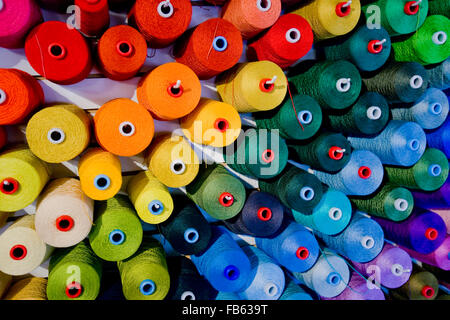 colorful thread on cone spools Stock Photo