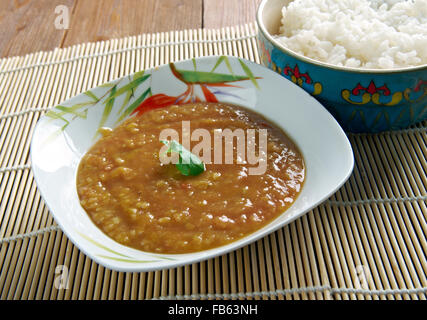 Dal bhat - traditional meal  Nepal, Bangladesh and India.consists of steamed rice and a cooked lentil soup called dal. Stock Photo