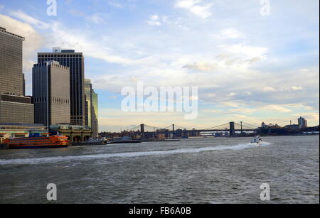 Moving NY Waterway ferry and early morning view of the New York skyline on the East River, New York City, New York, USA Stock Photo