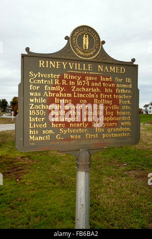 RINEYVILLE NAMED  Sylvester Riney gave land for Illinois Central R.R., 1874, and town named for family. Zachariah, his father, was Abraham Lincoln's first teacher while living on Rolling Fork. Zachariah moved to Rineyville site, 1830; built this double log house, later enlarged and clapboarded. Lived here nearly 25 years with his son, Sylvester. His grandson, Mancil G., was first postmaster.  Kentucky Historical Society, Kentucky Department of Highways, 1982 Stock Photo