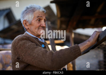 Rural old man smiling happy outdoor, closeup portrait Stock Photo
