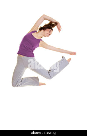Young flexible woman jumping while dancing Hip Hop Stock Photo