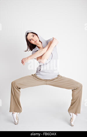 Cool female hiphop dancer and breakdancer standing on toptoes Stock Photo