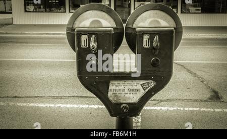 Pay To Park. Vintage parking meter in an urban setting. Stock Photo