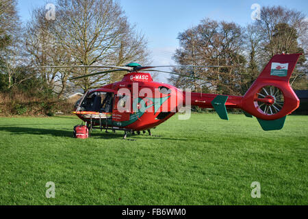 Presteigne, Powys, UK. The Wales Air Ambulance attends an incident in the town. A Eurocopter EC135 on the school playing fields Stock Photo