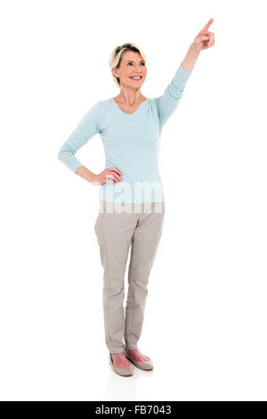 happy middle aged woman pointing at empty copy space isolated on white Stock Photo
