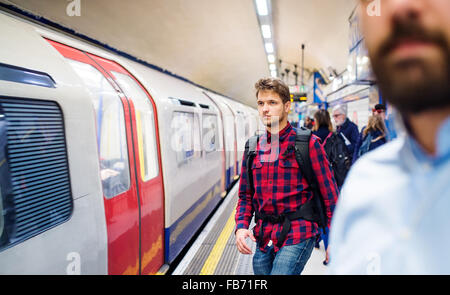 Young man in subway Stock Photo
