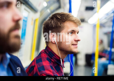 Young men in subway Stock Photo