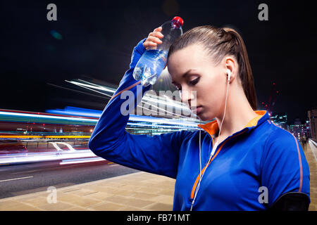 Woman jogging in city at night Stock Photo - Alamy