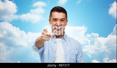 angry man shouting and pointing finger on you Stock Photo