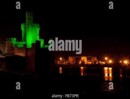 Blackrock Castle in Cork, Ireland basks in a green hue on the night of St. Patrick's Day. Stock Photo