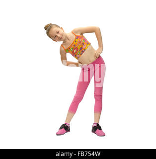 little girl does exercises on a white background Stock Photo