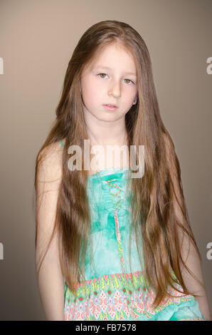 portrait of the little girl with long hair