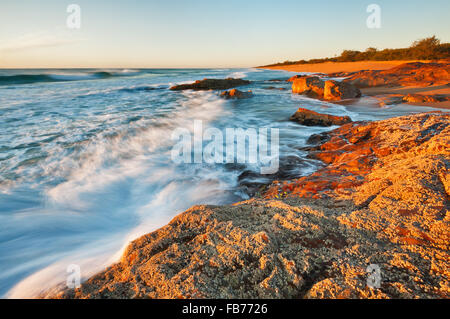 Rolling waves on Deepwater Beach on the Capricorn Coast.. Stock Photo