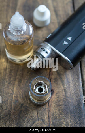 advanced vaping device on the table, e-cigarette close up Stock Photo