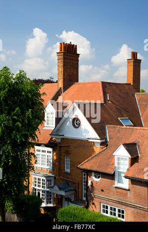 Terracota tiles and brick chimneys on an Arts and Crafts style house in Newton Grove, Bedford Park, Chiswick, London, UK Stock Photo