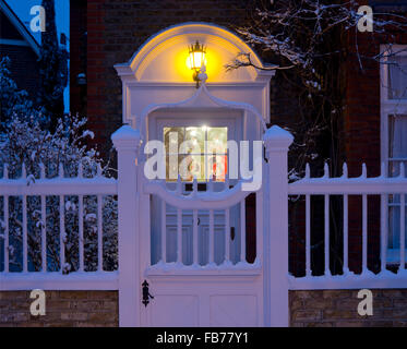 A snow covered front gate in Bedford Park, an enclave of Arts and Crafts style houses in west London, UK Stock Photo