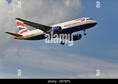 British Airways Airbus A320-232 G-EUUI landing at Heathrow Stock Photo